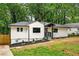 Charming home with manicured front yard, fresh white paint, and a welcoming entryway at 1599 Sandtown Rd, Atlanta, GA 30311