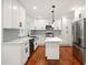 Modern kitchen featuring white cabinets, quartz counters, stainless steel appliances, and kitchen island at 1599 Sandtown Rd, Atlanta, GA 30311