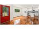 Open floor plan showcasing the stylish kitchen with stainless appliances and a bright red door at 1599 Sandtown Rd, Atlanta, GA 30311