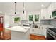 Modern kitchen with island, quartz counters, stainless steel appliances, and a bright, airy feel at 1599 Sandtown Rd, Atlanta, GA 30311
