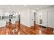Open kitchen and dining area featuring modern white cabinets and stainless steel appliances at 1599 Sandtown Rd, Atlanta, GA 30311
