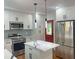 Stylish kitchen with white cabinets, stainless steel appliances, a kitchen island, and granite countertops at 1599 Sandtown Rd, Atlanta, GA 30311