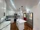 Stylish kitchen featuring white cabinets, granite countertops, stainless steel appliances, and island at 1599 Sandtown Rd, Atlanta, GA 30311