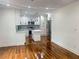 Open-concept kitchen with white cabinetry, stainless steel appliances, and a modern island at 1599 Sandtown Rd, Atlanta, GA 30311
