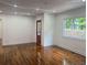 Spacious living room with hardwood floors, freshly painted white walls, with natural light at 1599 Sandtown Rd, Atlanta, GA 30311