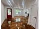 Bright living room with hardwood floors, freshly painted white walls, and a view of the front yard at 1599 Sandtown Rd, Atlanta, GA 30311