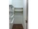 Organized pantry with custom white shelves and brass hardware, providing ample storage at 1599 Sandtown Rd, Atlanta, GA 30311