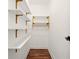 Walk-in closet featuring custom shelving for optimum storage with hardwood floors at 1599 Sandtown Rd, Atlanta, GA 30311