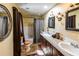 Bathroom features granite countertops, dual vanity sinks, and a shower-tub combo at 689 Hardin Rd, Temple, GA 30179