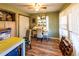 Cozy bedroom features wood laminate flooring, natural light, and an inviting desk at 689 Hardin Rd, Temple, GA 30179