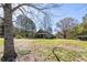 Charming single story brick home with covered porch, large yard, and outbuilding at 689 Hardin Rd, Temple, GA 30179