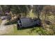Aerial view of the back side of the house, featuring a small deck and spacious yard at 689 Hardin Rd, Temple, GA 30179
