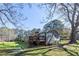 Home exterior features a large deck and spacious backyard perfect for outdoor enjoyment at 689 Hardin Rd, Temple, GA 30179