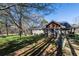 Inviting home exterior showcasing a well-manicured lawn, mature trees, and a serene outdoor ambiance at 689 Hardin Rd, Temple, GA 30179