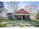 Charming brick home featuring a cozy front porch and a decorative star above the entrance at 689 Hardin Rd, Temple, GA 30179