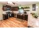 Modern kitchen featuring stainless steel appliances, dark cabinetry, and unique backsplash and countertops at 689 Hardin Rd, Temple, GA 30179