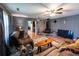 Cozy living room with a brick fireplace, plush seating, and view into the kitchen at 689 Hardin Rd, Temple, GA 30179