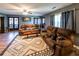 Comfortable living room with plush seating, area rug, and French doors at 689 Hardin Rd, Temple, GA 30179
