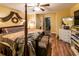 Comfortable main bedroom with wood laminate flooring, an ensuite bathroom, and a decorative bed at 689 Hardin Rd, Temple, GA 30179