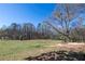 Picturesque view of a large field, showcasing the natural beauty and tranquility of the surrounding landscape at 689 Hardin Rd, Temple, GA 30179