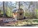 Wooden storage shed with heart detail, offering an outdoor storage solution at 689 Hardin Rd, Temple, GA 30179