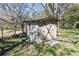 Charming backyard shed with weathered wood, offering ample outdoor storage space at 689 Hardin Rd, Temple, GA 30179