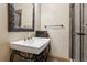 Stylish bathroom features a vessel sink with decorative mirror and a glass-enclosed shower at 1320 Magnolia Park Cir, Cumming, GA 30040