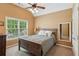 Bedroom features a large window, closet and vaulted ceiling at 1320 Magnolia Park Cir, Cumming, GA 30040