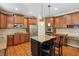 Spacious kitchen boasts stainless appliances, granite counters, and custom cabinetry at 1320 Magnolia Park Cir, Cumming, GA 30040