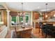 Inviting eat-in kitchen with backyard deck access, granite counters, and custom cabinetry at 1320 Magnolia Park Cir, Cumming, GA 30040