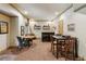 Finished basement area with seating, a dining table and a wet bar at 1320 Magnolia Park Cir, Cumming, GA 30040