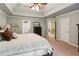 Spacious main bedroom features a tray ceiling and ensuite access at 1320 Magnolia Park Cir, Cumming, GA 30040