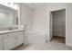 Bright bathroom featuring a soaking tub, granite countertops, and a walk-in closet at 2561 Grapevine Cir # 104, Cumming, GA 30041