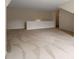 Large room featuring neutral carpet, fresh paint, and natural light at 2561 Grapevine Cir # 104, Cumming, GA 30041