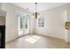 Light-filled dining area featuring hardwood floors, double doors, a chandelier, and views of the outdoors at 2561 Grapevine Cir # 104, Cumming, GA 30041