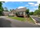 Charming single-Gathering home featuring a welcoming entrance, manicured lawn, and inviting architectural details at 2561 Grapevine Cir # 104, Cumming, GA 30041