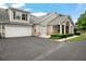 Charming home featuring a two-car garage, manicured landscaping, and inviting curb appeal at 2561 Grapevine Cir # 104, Cumming, GA 30041