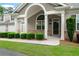 Well-maintained exterior with manicured landscaping, brick accents, and a welcoming entrance at 2561 Grapevine Cir # 104, Cumming, GA 30041