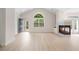 Spacious living room filled with natural light, hardwood floors, and a cozy fireplace at 2561 Grapevine Cir # 104, Cumming, GA 30041