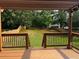 Wood deck with a view of the backyard, a large lawn, and a wood fence at 3360 Keenland Rd, Marietta, GA 30062