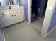 Ensuite bathroom featuring a white vanity with pink drawer pulls and tile flooring at 3360 Keenland Rd, Marietta, GA 30062