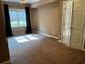 Cozy bedroom with great natural light, neutral paint and carpet, and a double door closet at 3360 Keenland Rd, Marietta, GA 30062