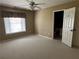 Bedroom with a ceiling fan, window with blinds, and access to an ensuite bathroom at 3360 Keenland Rd, Marietta, GA 30062