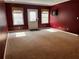 Bonus room with neutral carpet, trim, and nice natural light from two windows and a door at 3360 Keenland Rd, Marietta, GA 30062