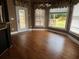 Bright breakfast nook featuring hardwood floors, large windows, and a door leading to an outdoor deck at 3360 Keenland Rd, Marietta, GA 30062