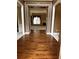 Elegant foyer featuring gleaming hardwood floors, decorative molding, and an open view to the living area at 3360 Keenland Rd, Marietta, GA 30062