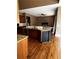 Open-concept kitchen with granite countertops, stainless steel appliances, and hardwood floors, adjacent to the living area at 3360 Keenland Rd, Marietta, GA 30062