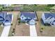 Aerial view of the property showcasing the home, yard, and surrounding neighborhood with privacy fence in the backyard at 4607 Underwood Walk, Powder Springs, GA 30127