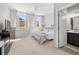 This bedroom features two windows, a dresser, and a bed with floral bedding at 4607 Underwood Walk, Powder Springs, GA 30127