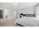 Simple bedroom with carpet flooring, modern furniture, and natural light at 4607 Underwood Walk, Powder Springs, GA 30127